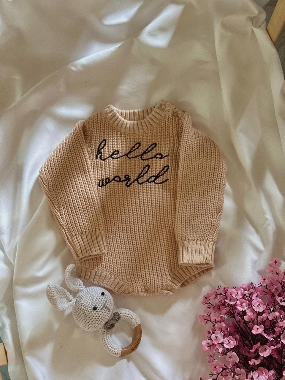 Hello World romper on wooden hanger